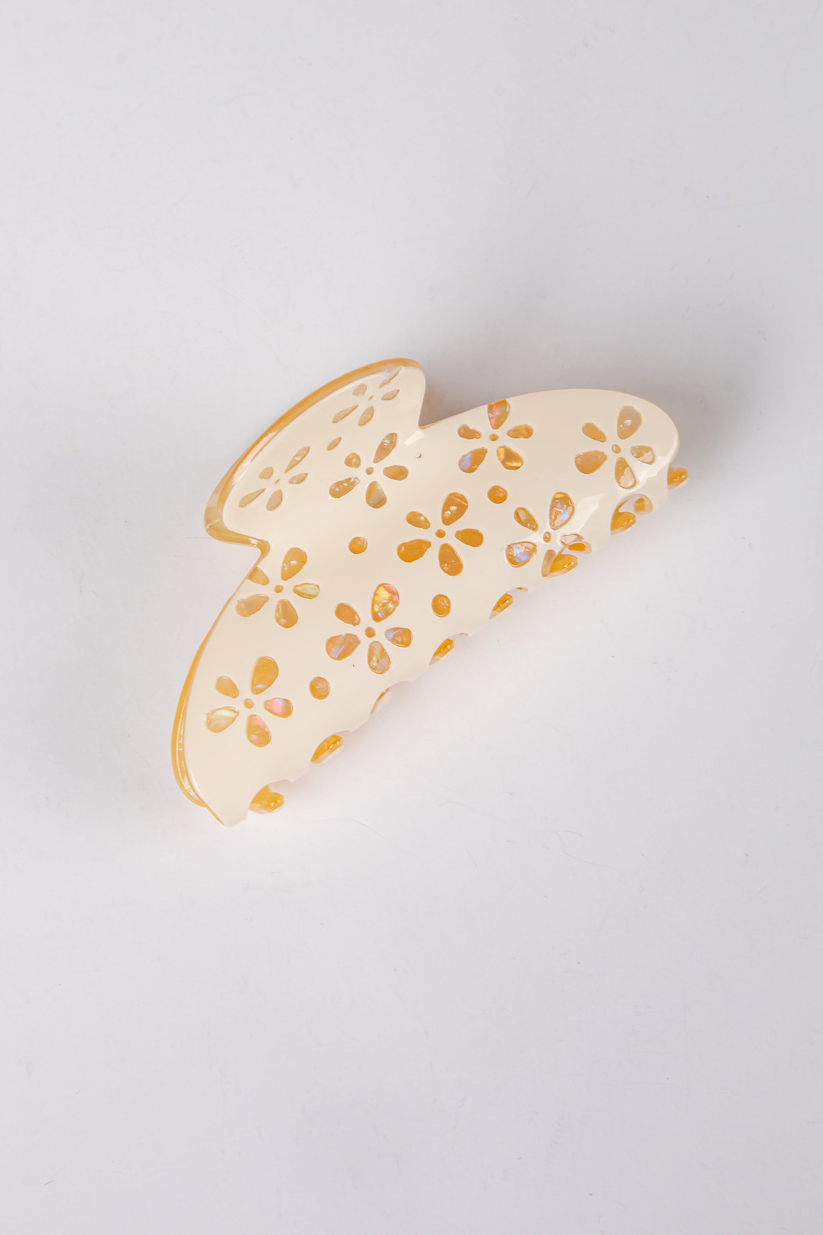 hair clip with floral patterns on a light gray background
