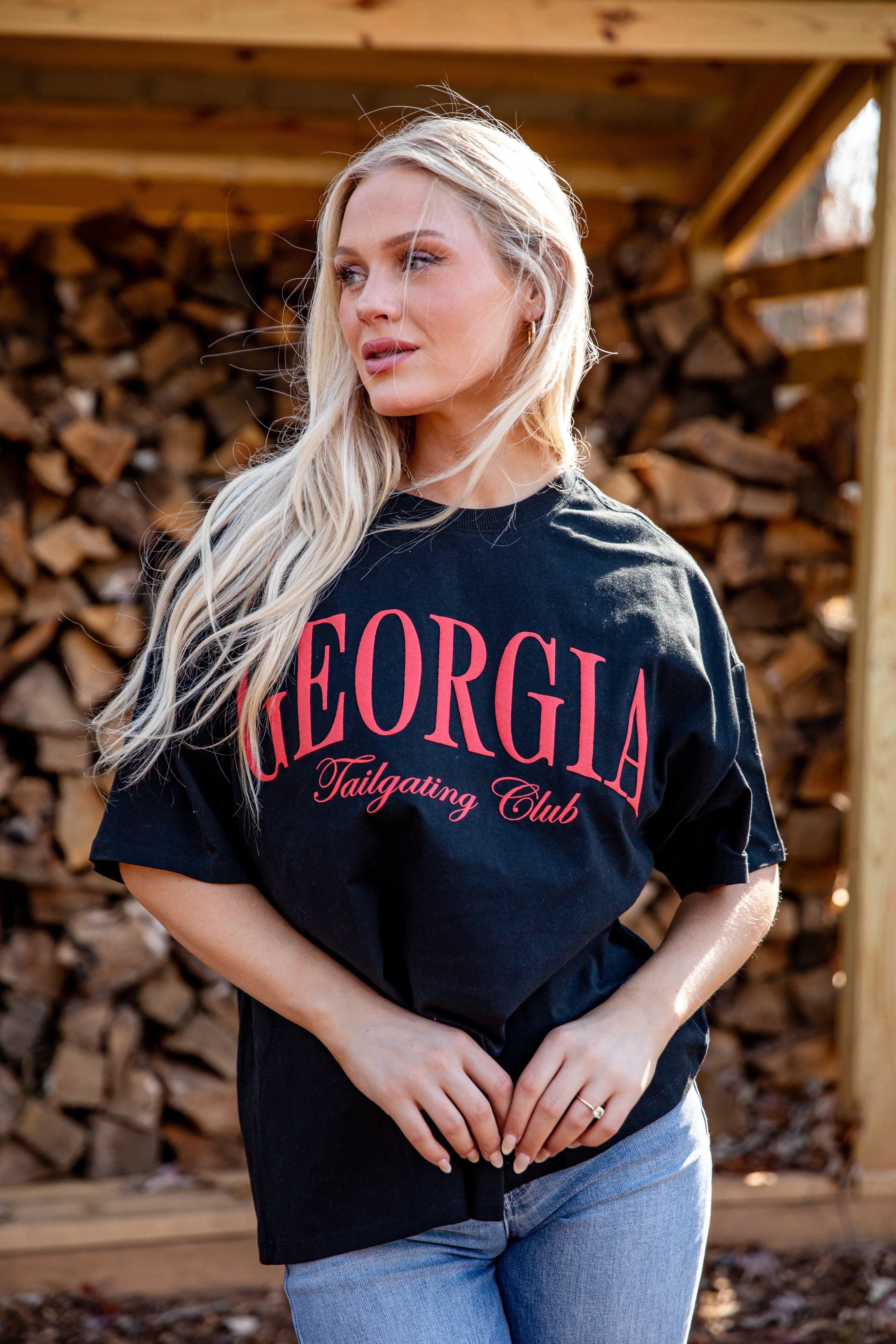 Woman wearing a black t-shirt with &