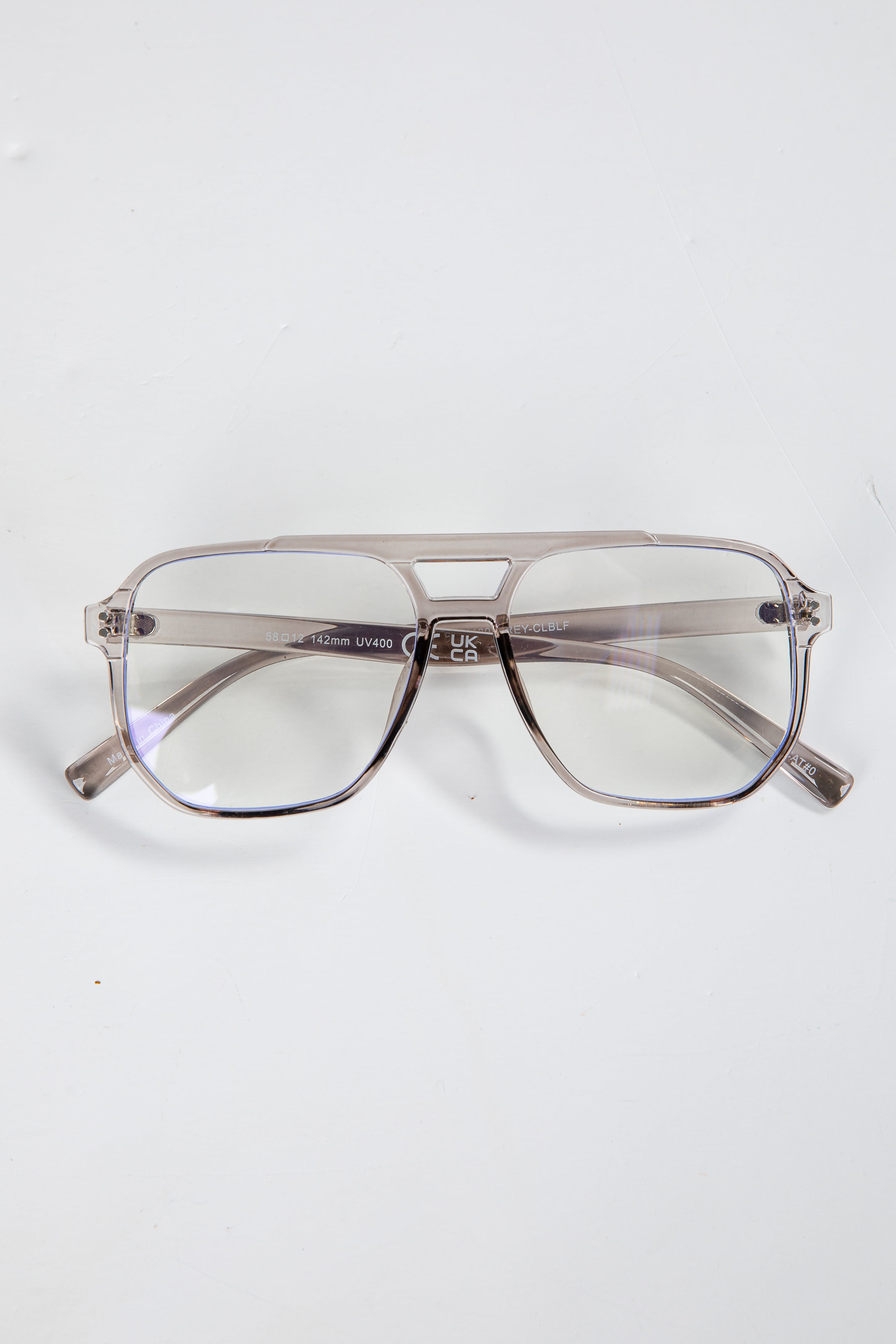 Gray aviator sunglasses on a white background