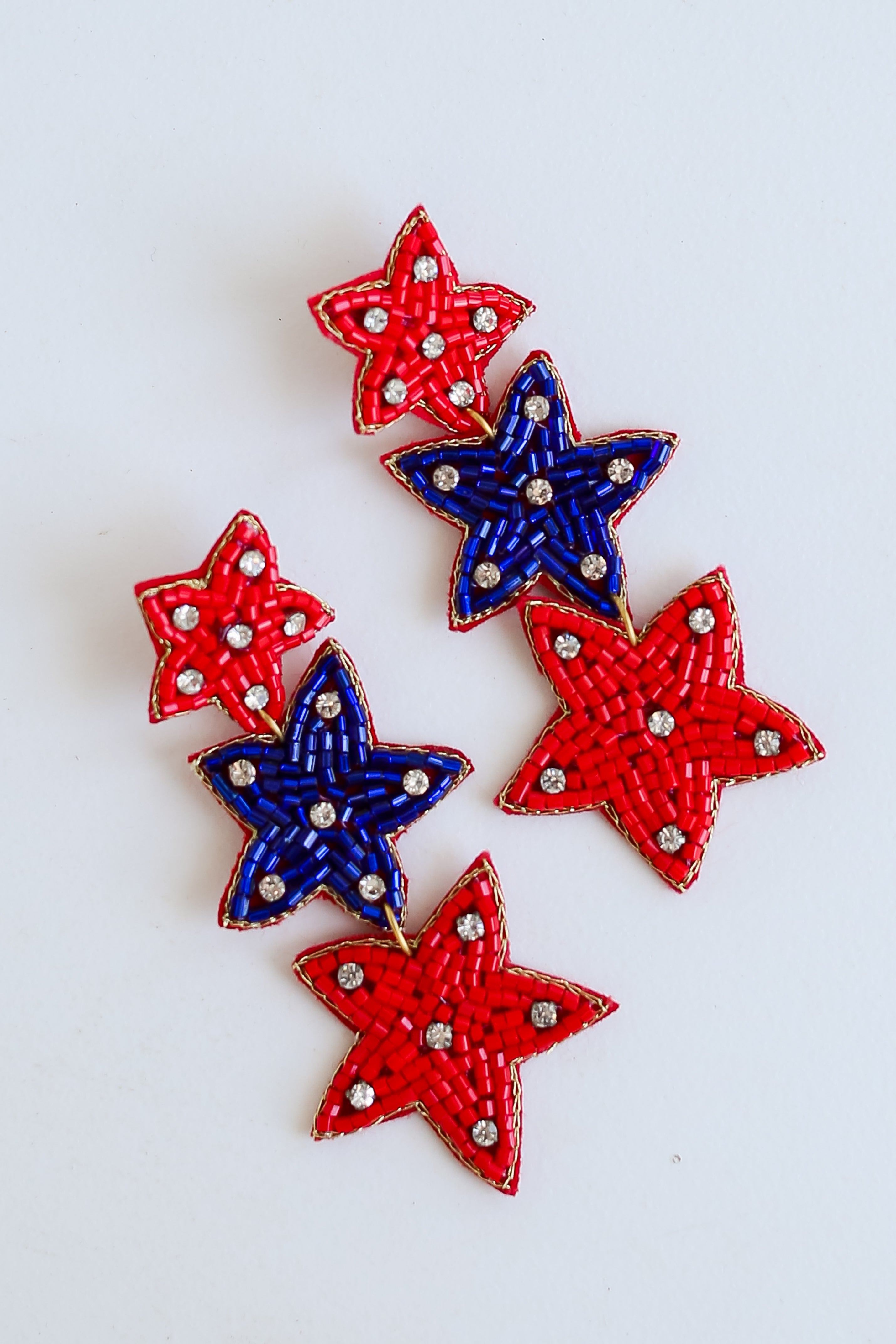 Red + Blue Beaded Star Drop Earrings flat lay
