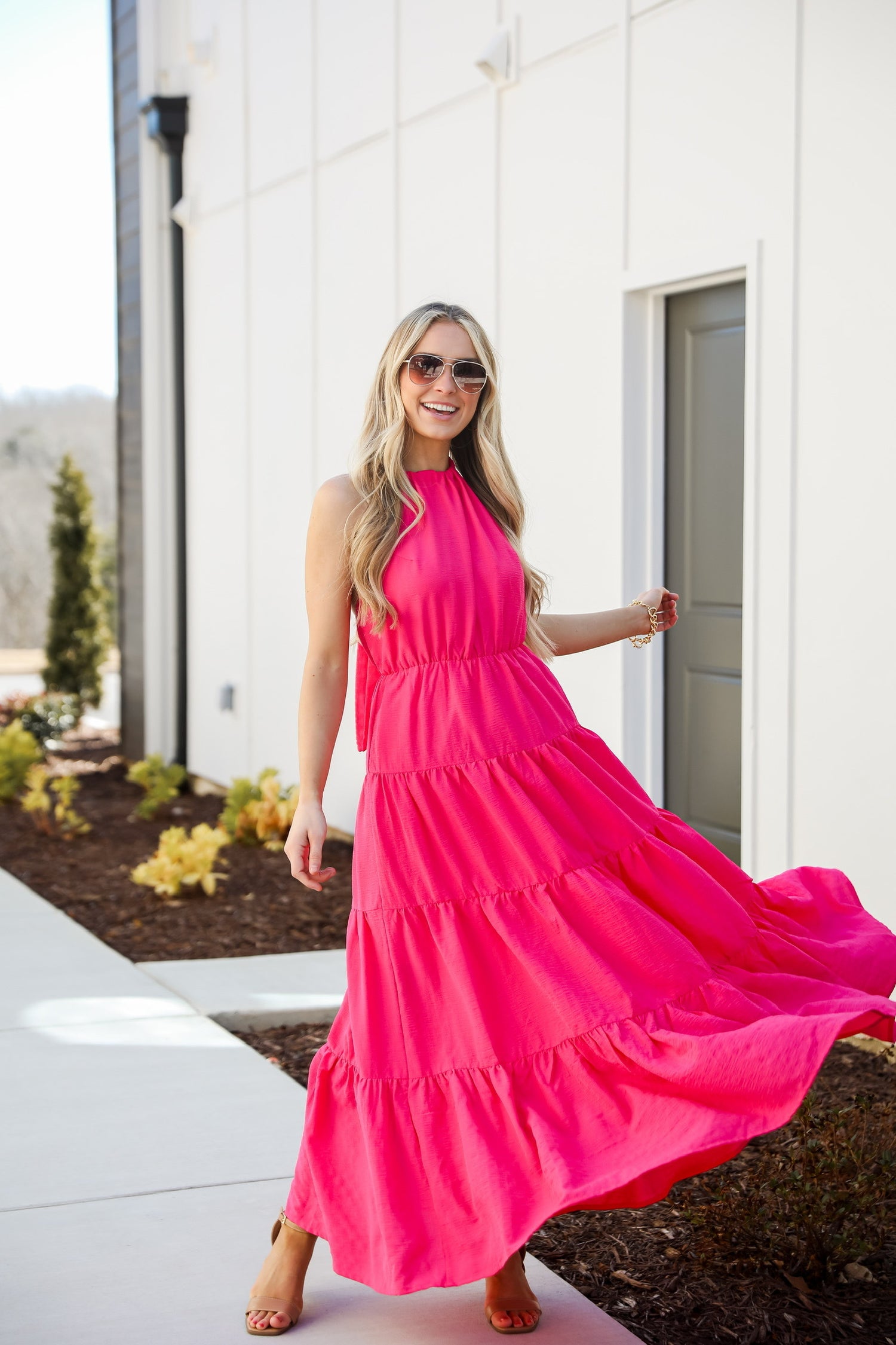 Harvey Boutique model in a pink maxi dress