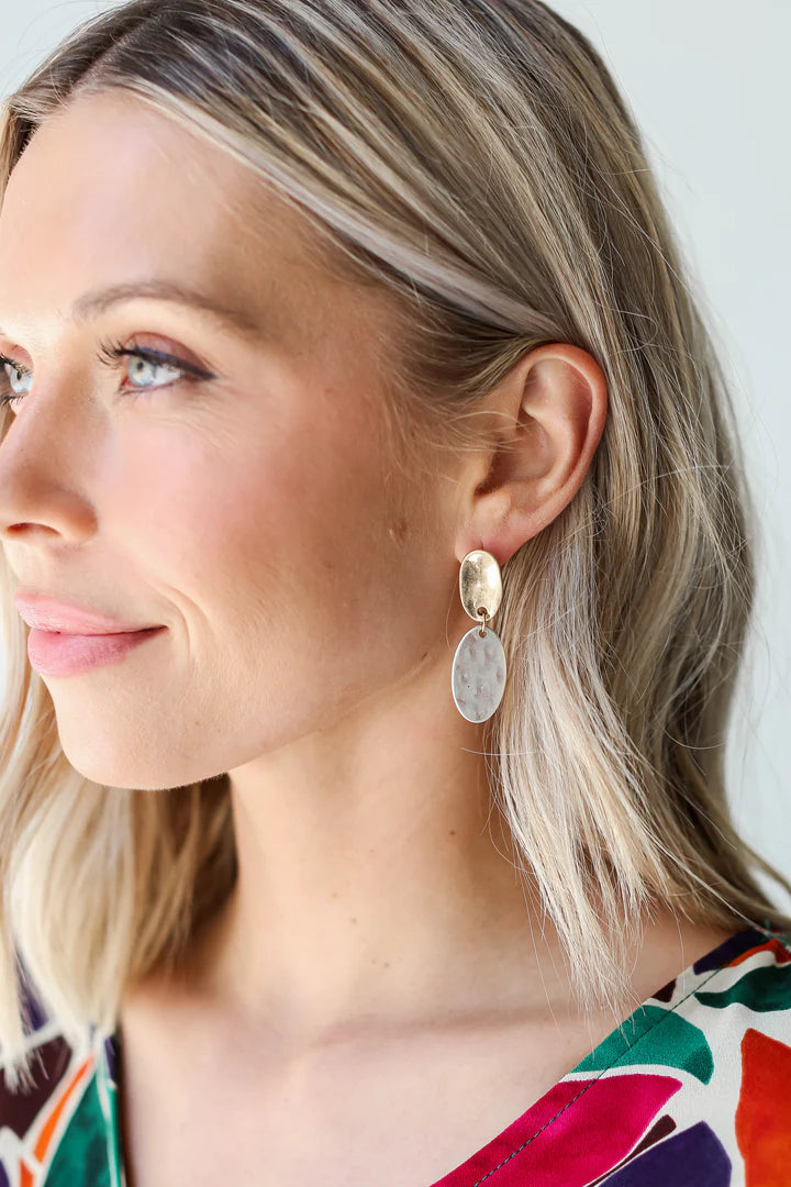 Close up of Harvey Boutique model showcasing earrings