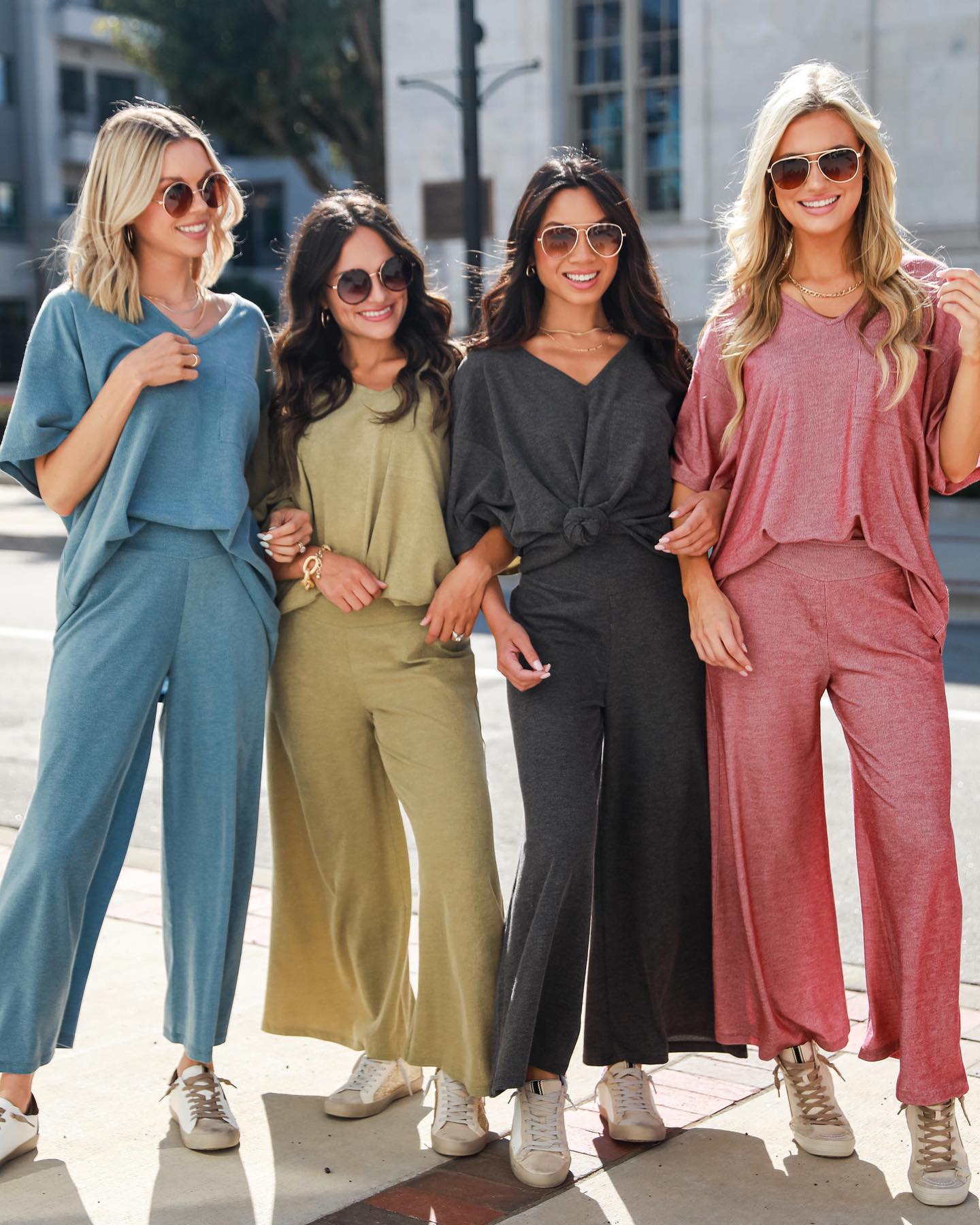 4 Harvey Boutique models wearing matching sets in various colors