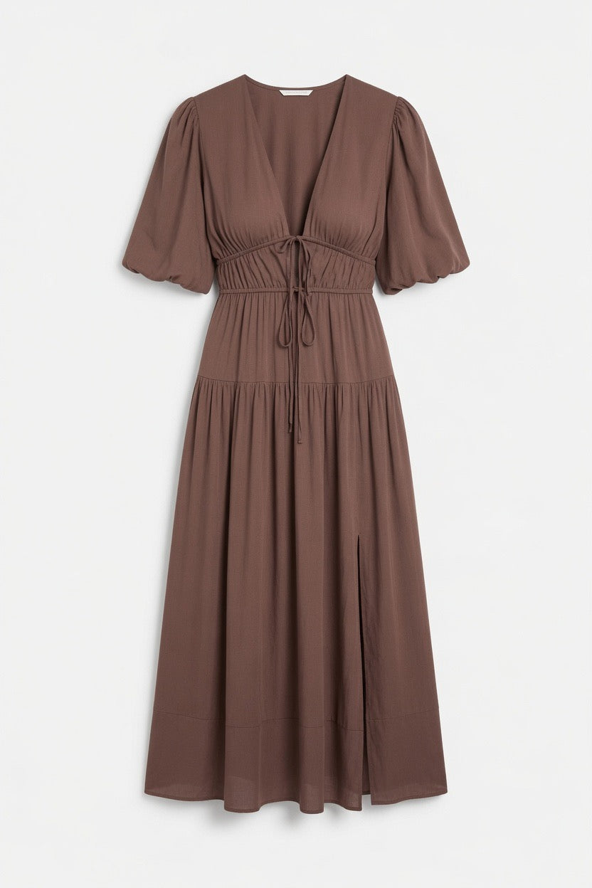 A brown midi-length dress with short puff sleeves, a V-neckline, and a drawstring waist, shown against a plain light gray background.
