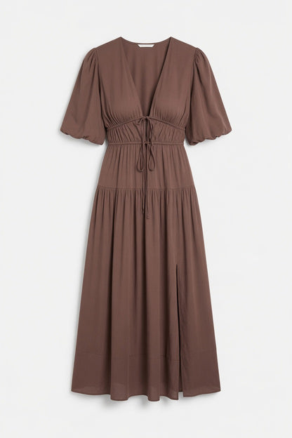 A brown midi-length dress with short puff sleeves, a V-neckline, and a drawstring waist, shown against a plain light gray background.