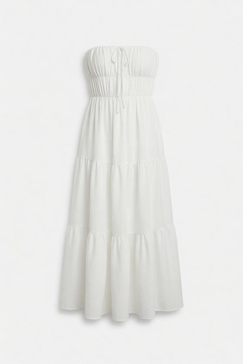 A strapless white tiered midi dress with a smocked bodice and drawstring details, shown against a plain white background.