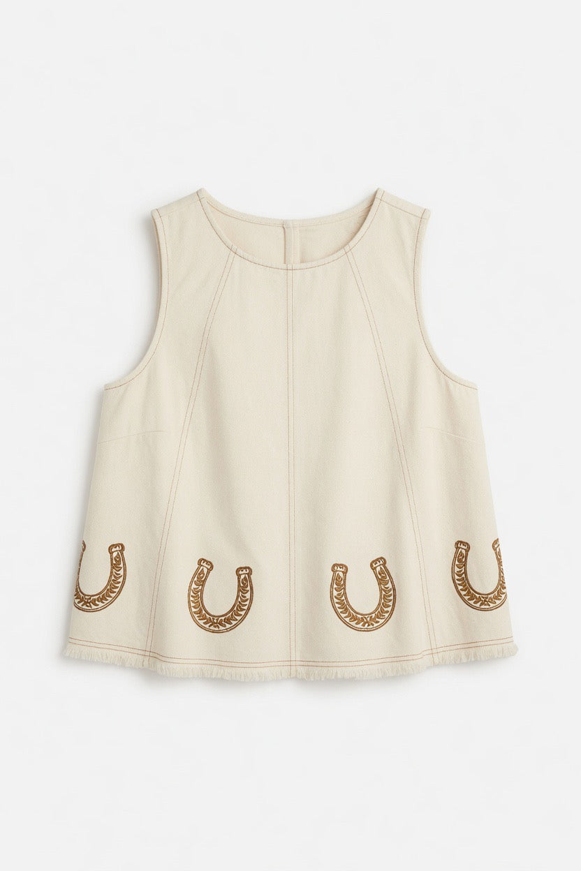 A sleeveless cream-colored top with a crew neck and three embroidered gold horseshoes along the bottom hem, displayed on a clean white background.