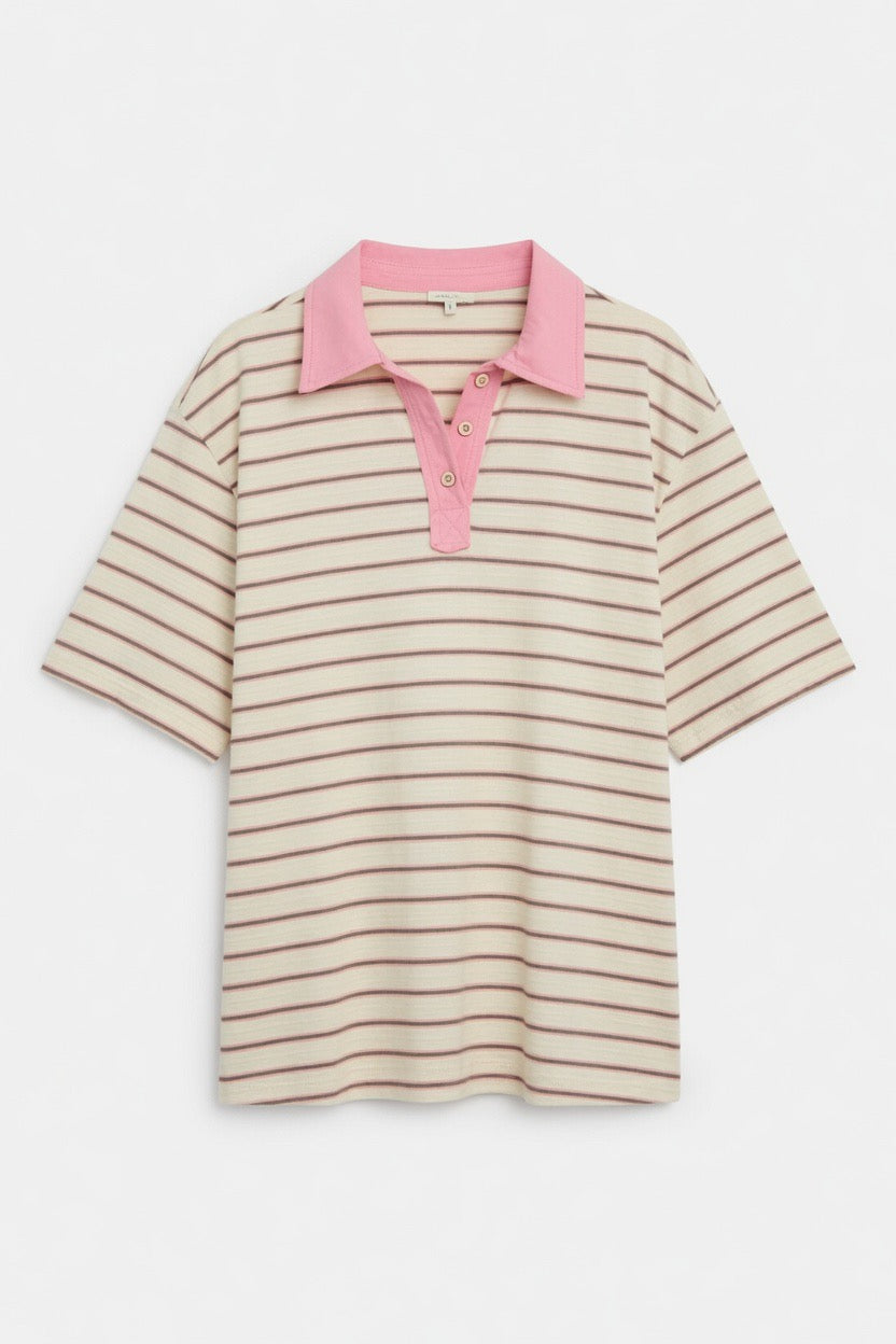 A short-sleeve polo shirt with thin horizontal beige and brown stripes, featuring a solid pink collar and matching pink button placket, displayed on a clean white background.