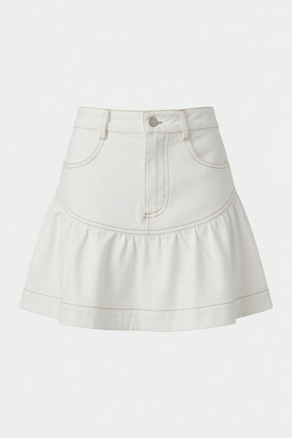 A close-up of a white denim mini skirt with a ruffled hem and contrast tan stitching
