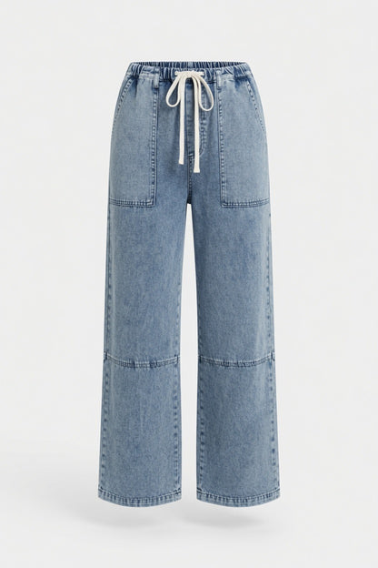 Light blue wide-leg denim pants with a drawstring waist and front patch pockets, shown on a plain light gray background.