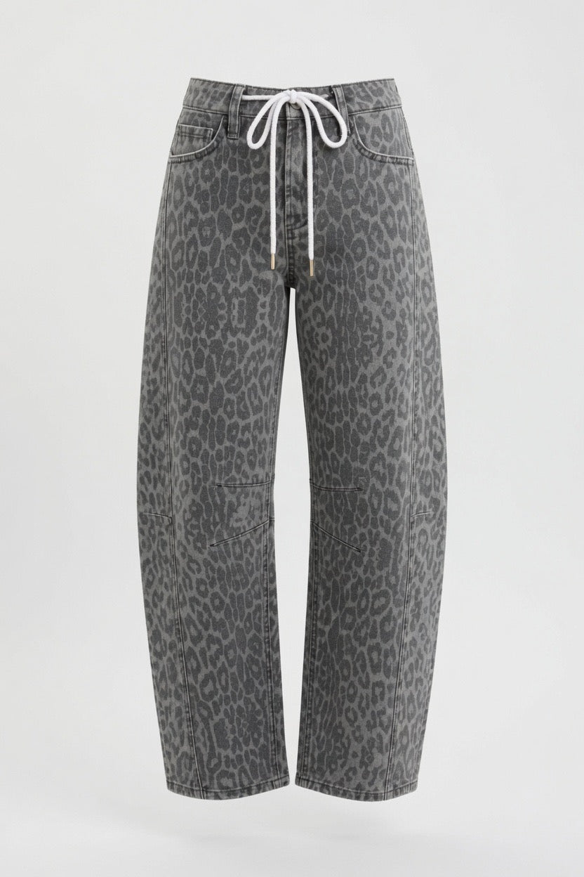 Gray leopard-print cropped jeans with a white drawstring waist, shown against a plain light gray background.