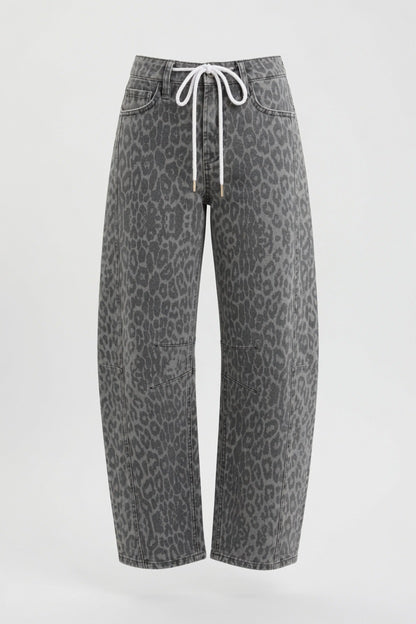 Gray leopard-print cropped jeans with a white drawstring waist, shown against a plain light gray background.