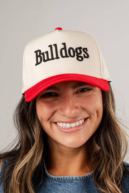 Person wearing a cap with &