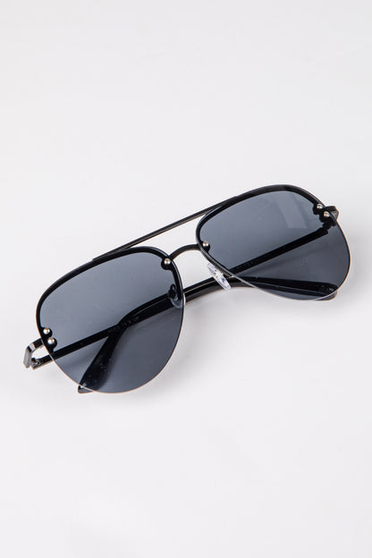 Black sunglasses with dark lenses on a white background