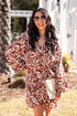 Woman wearing a brown and white patterned dress outdoors.