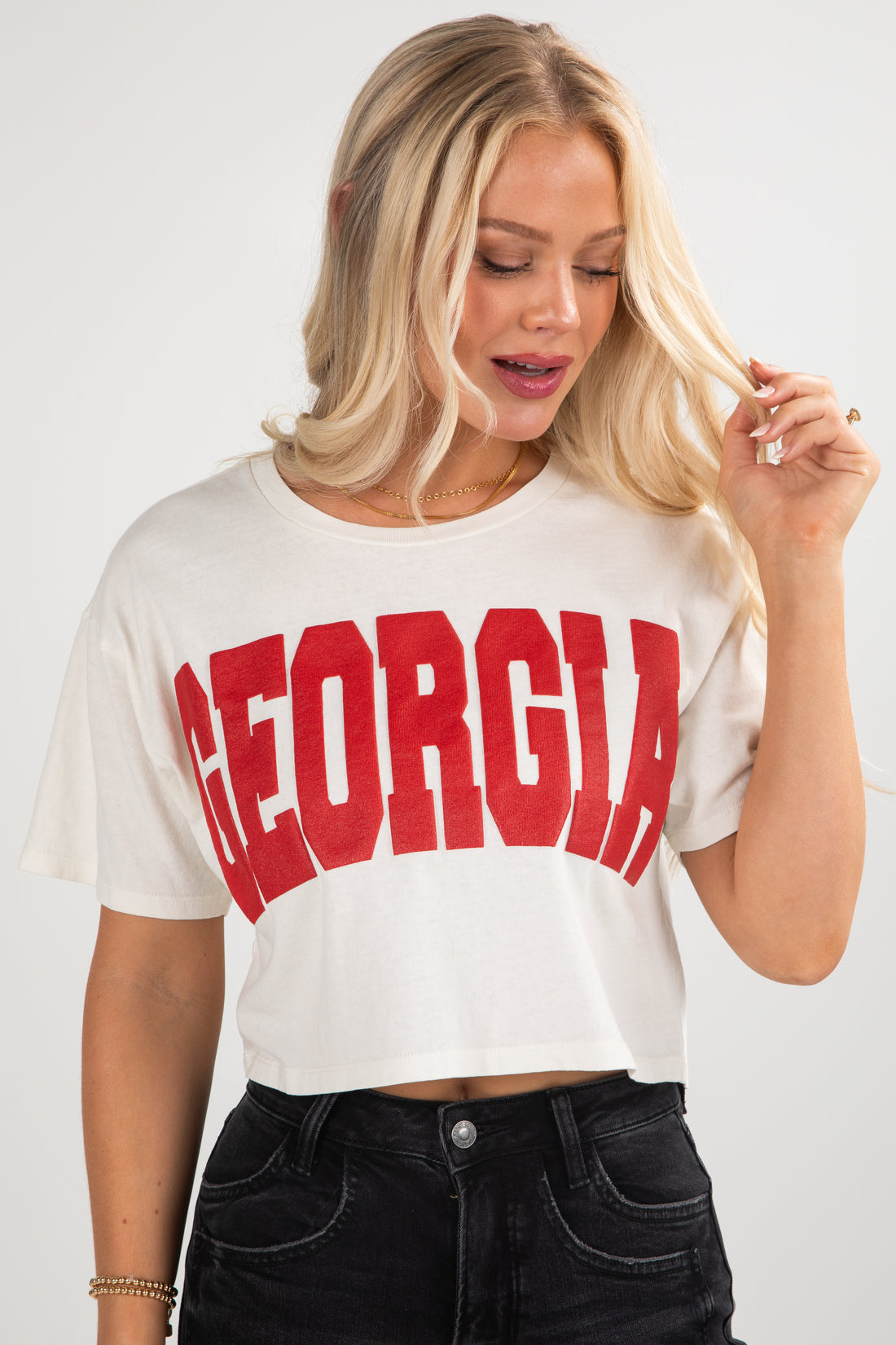 Woman wearing a white t-shirt with &