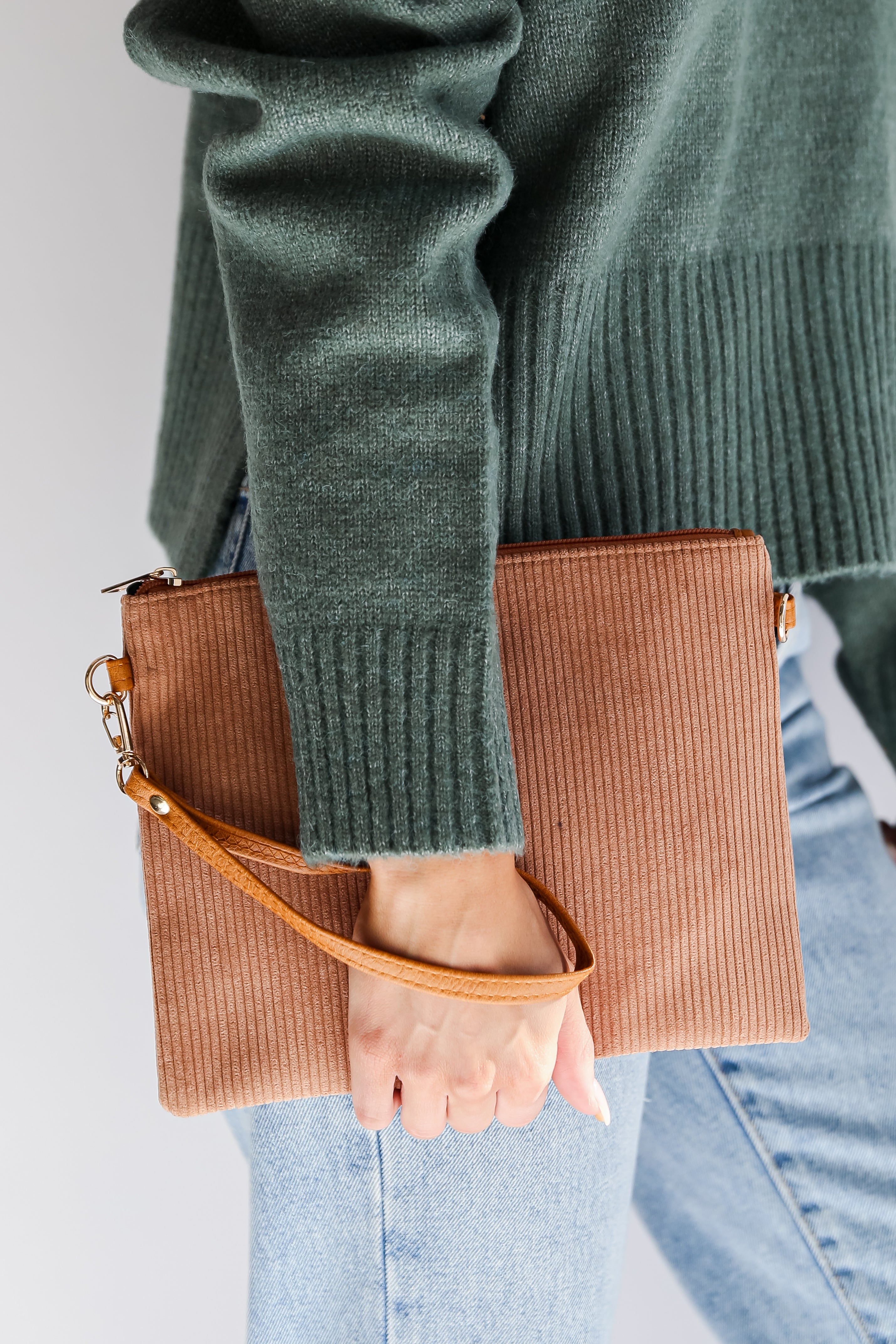 model holding a Camel Corduroy Crossbody Bag
