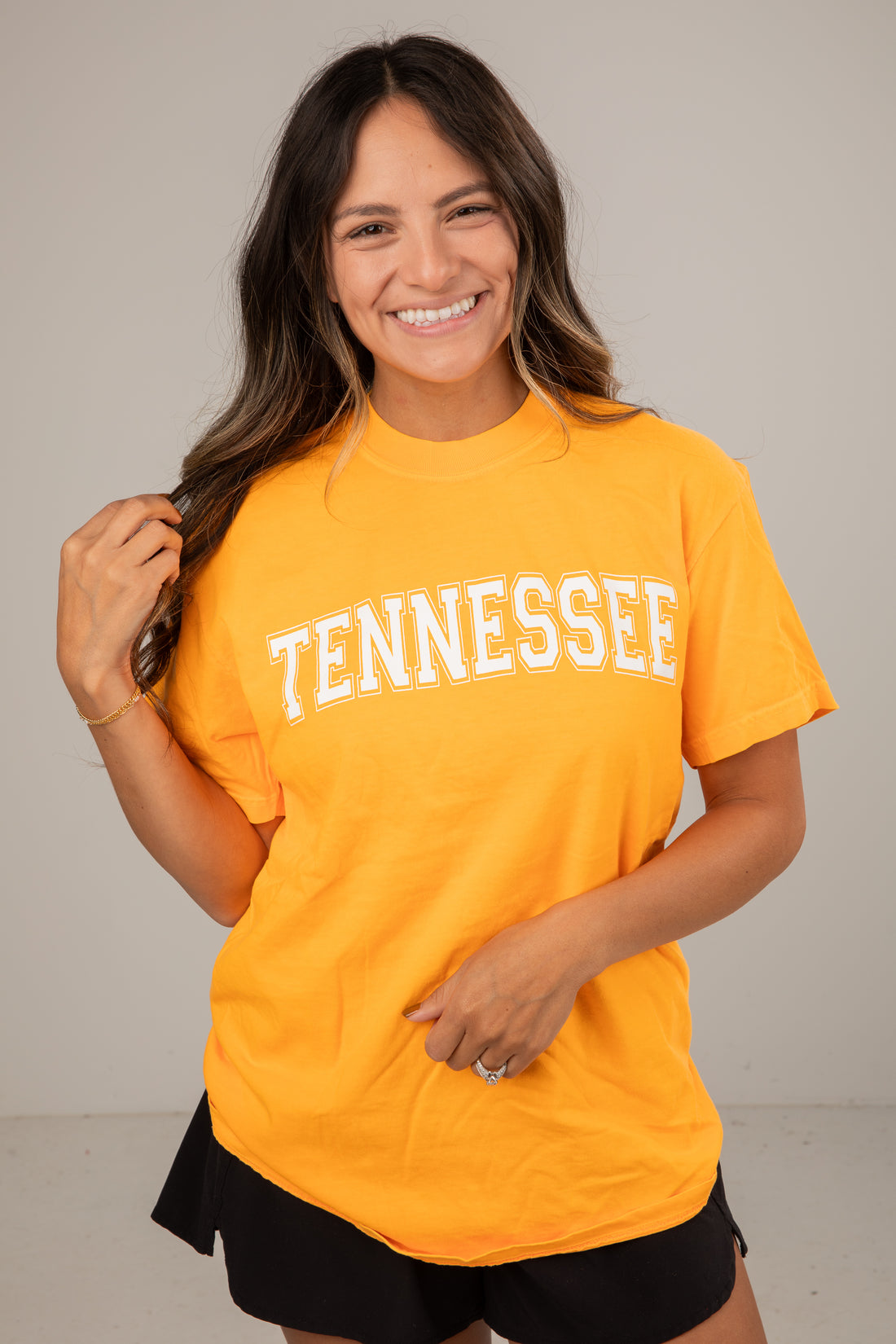 Woman wearing a yellow &