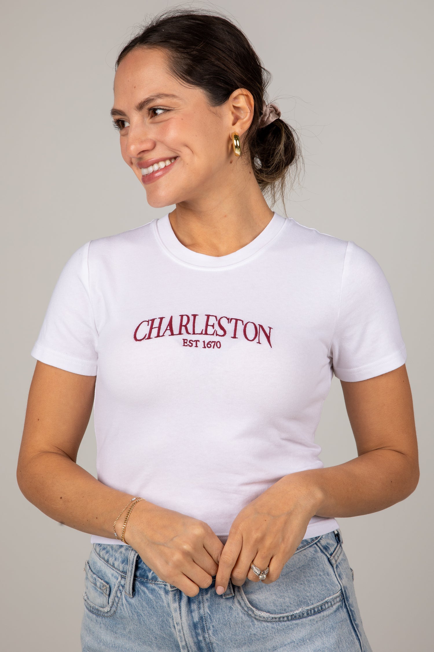 Woman wearing a white t-shirt with &