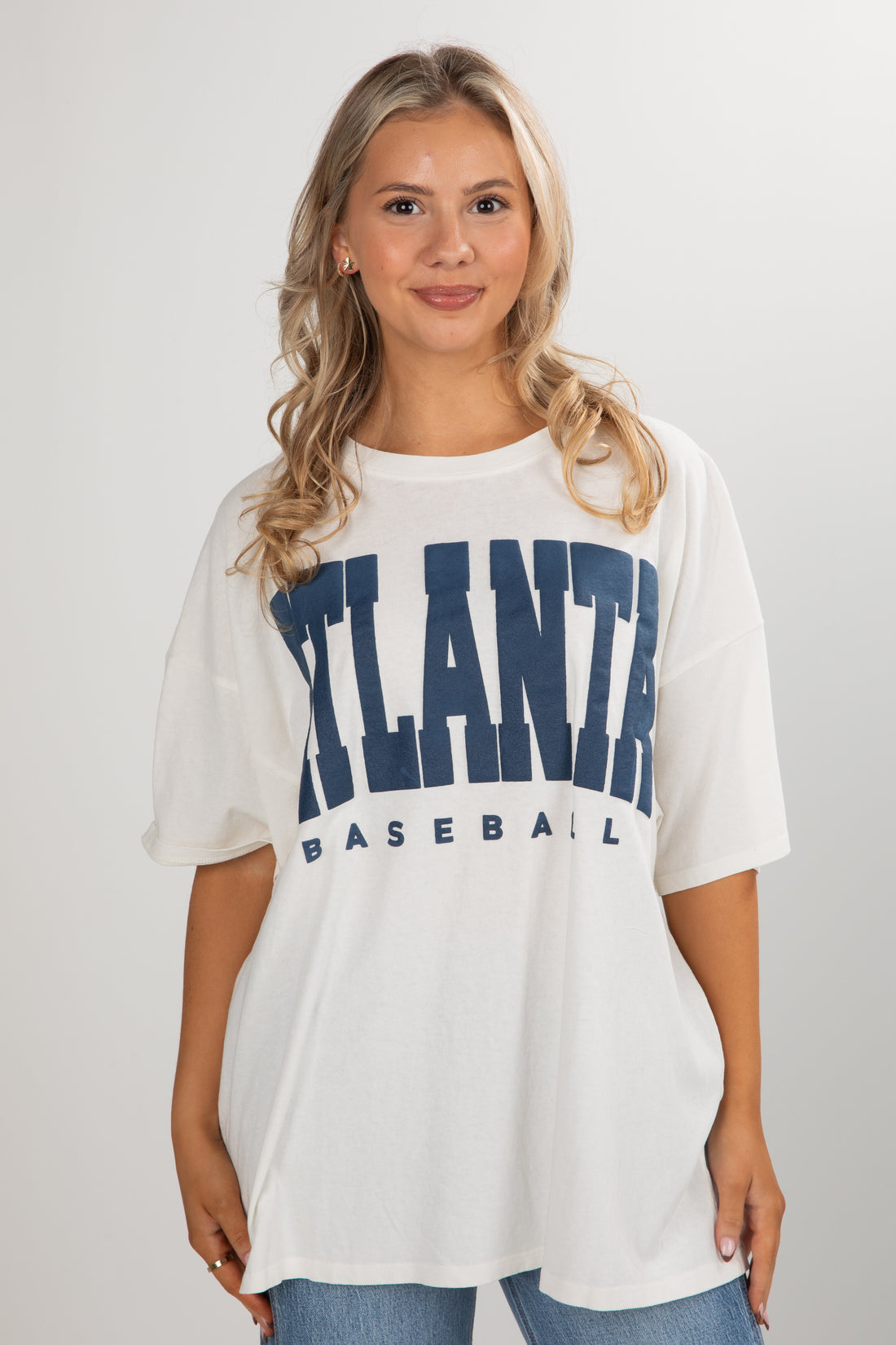 Woman wearing a white t-shirt with &