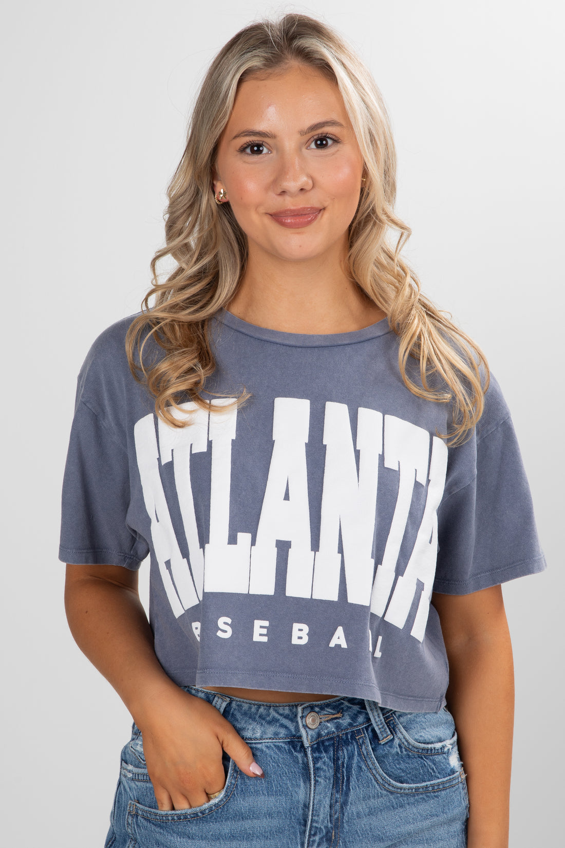 Woman wearing a blue t-shirt with &
