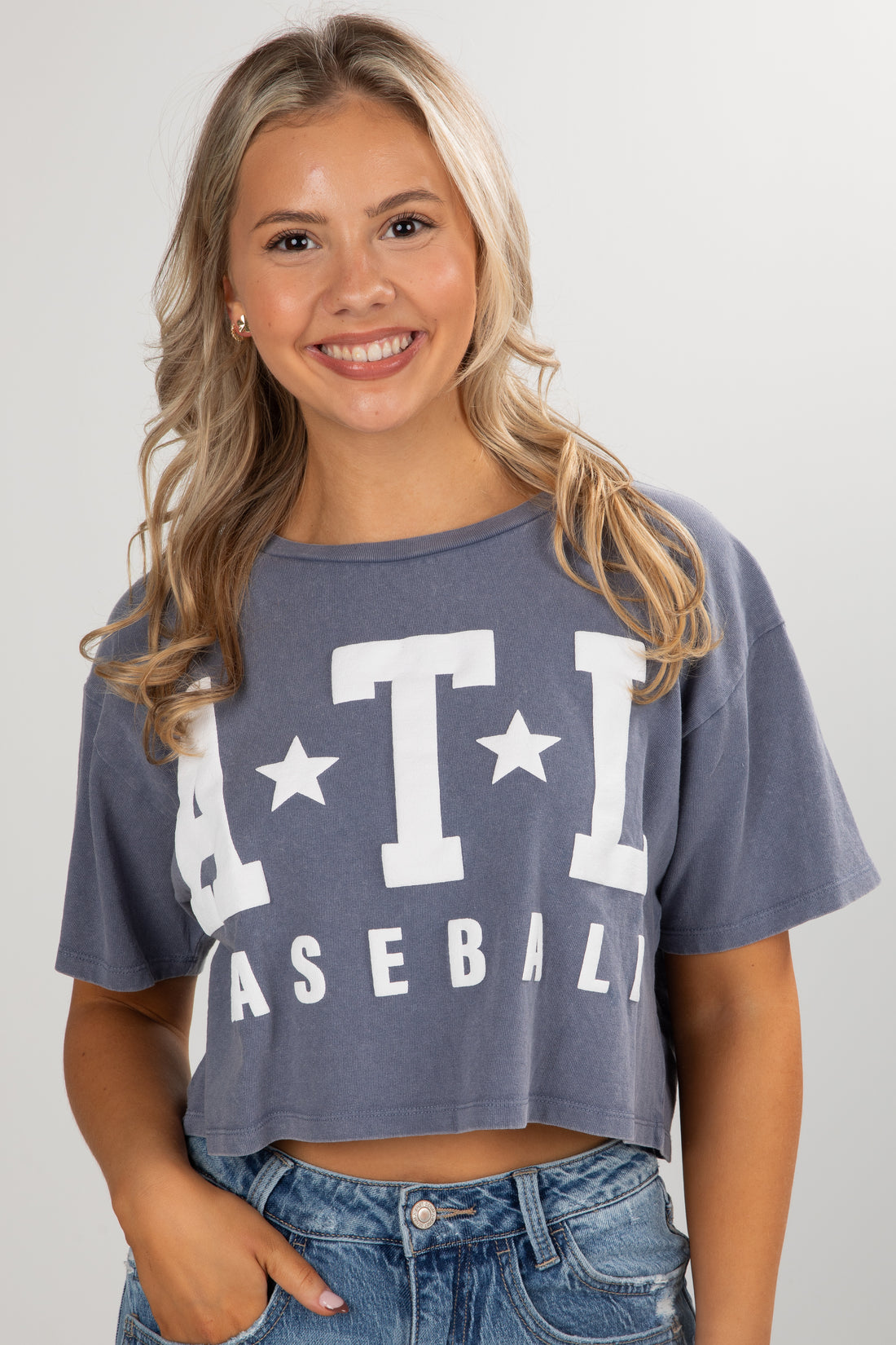 Woman wearing a blue crop top with &