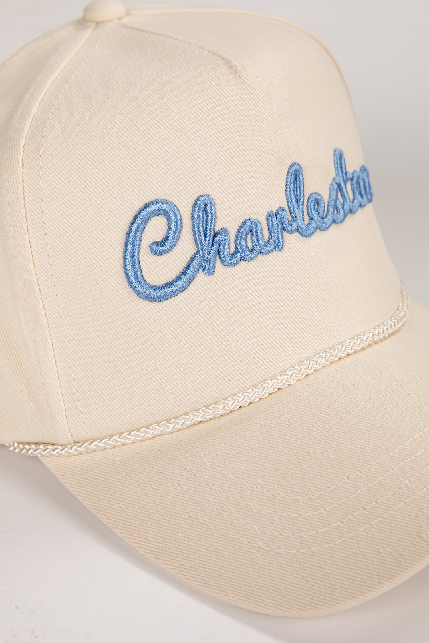 Beige cap with &