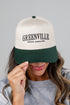 Person wearing a cap with &