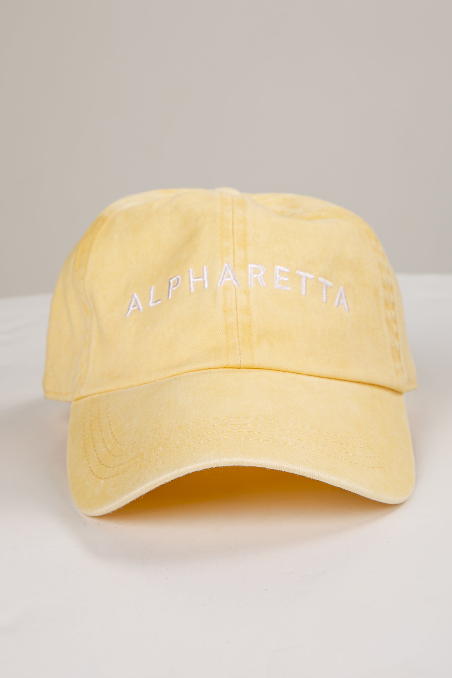 Yellow cap with &