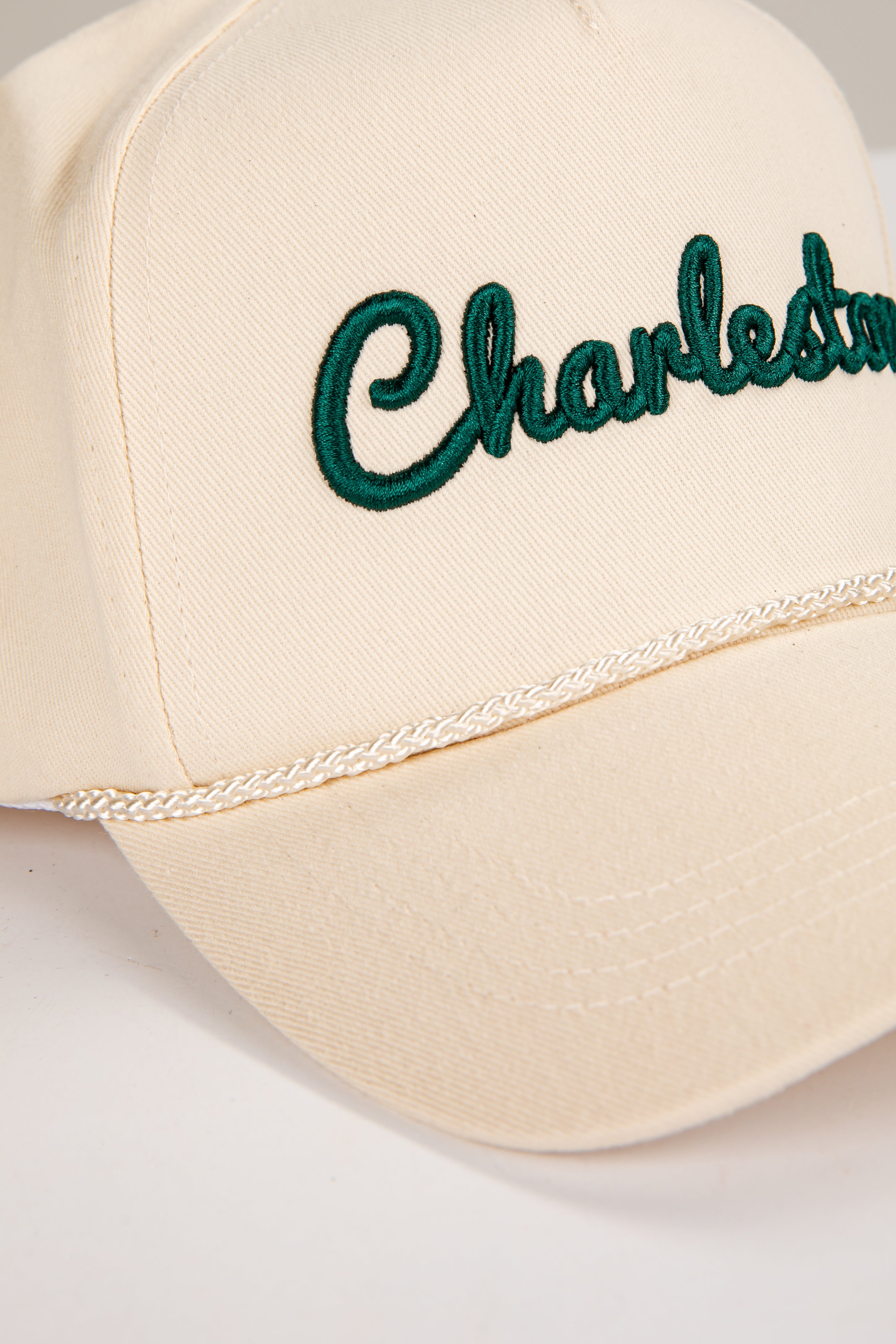 Beige cap with &
