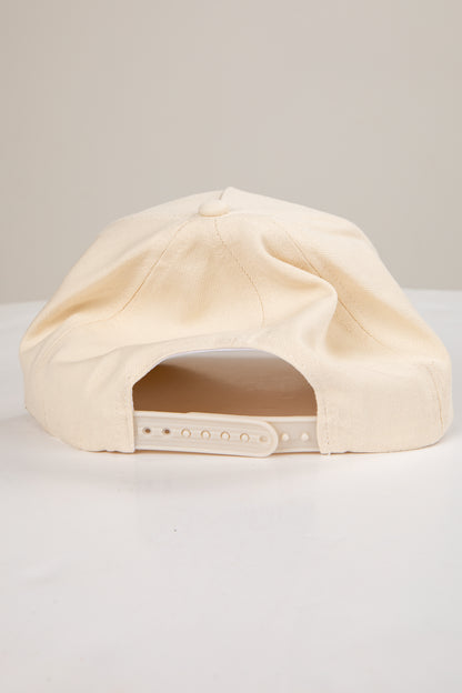 Beige cap on a light gray background