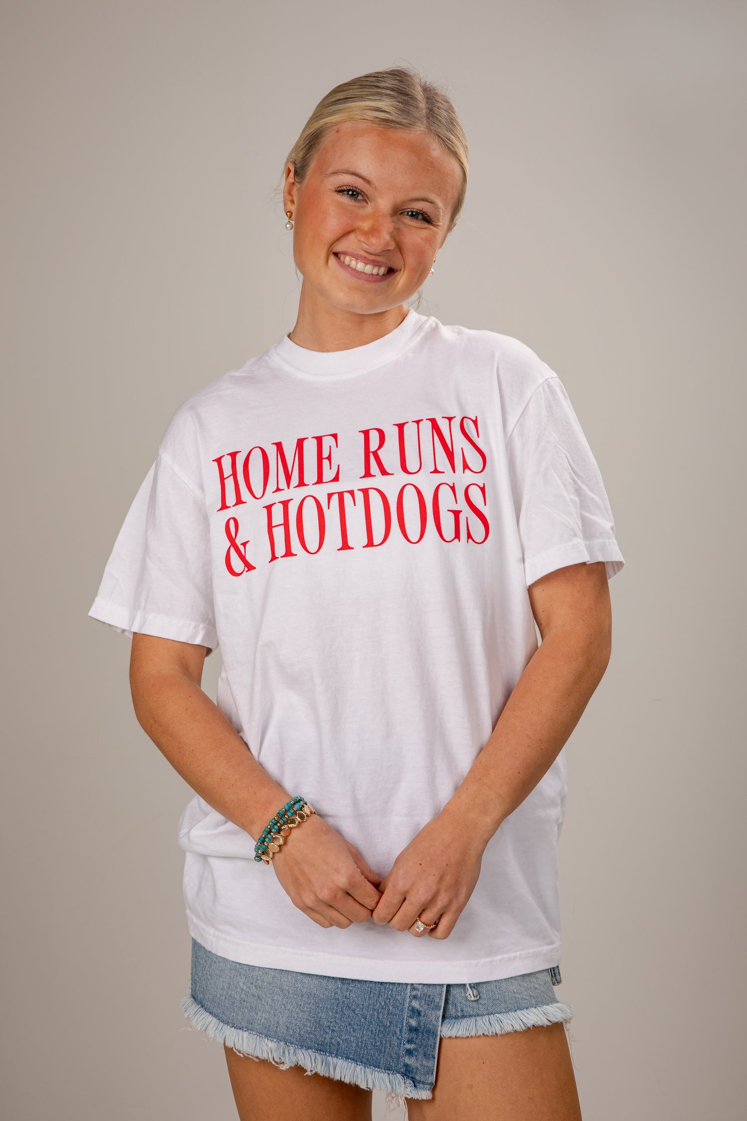 Person wearing a white t-shirt with &