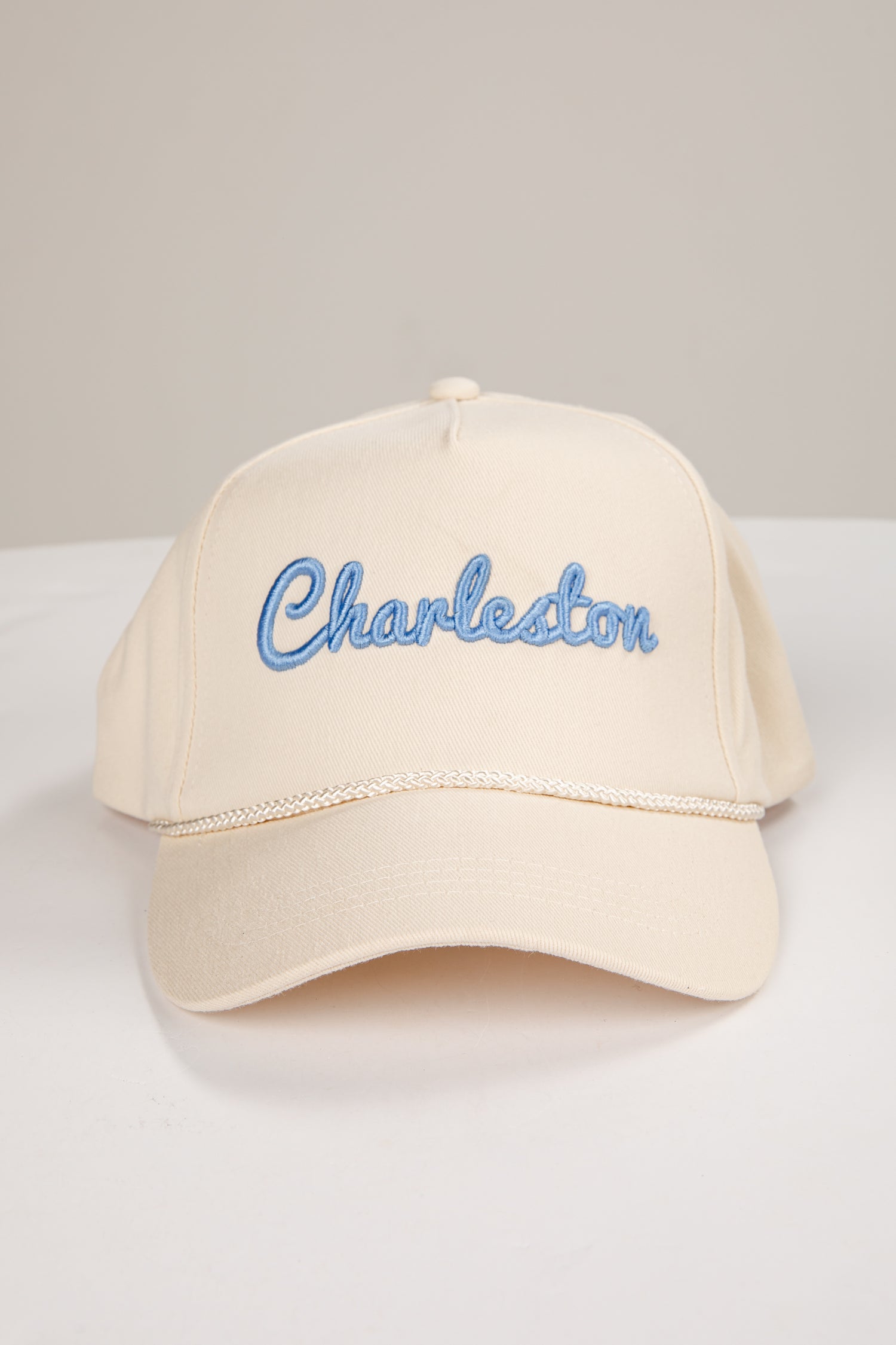 Beige cap with &