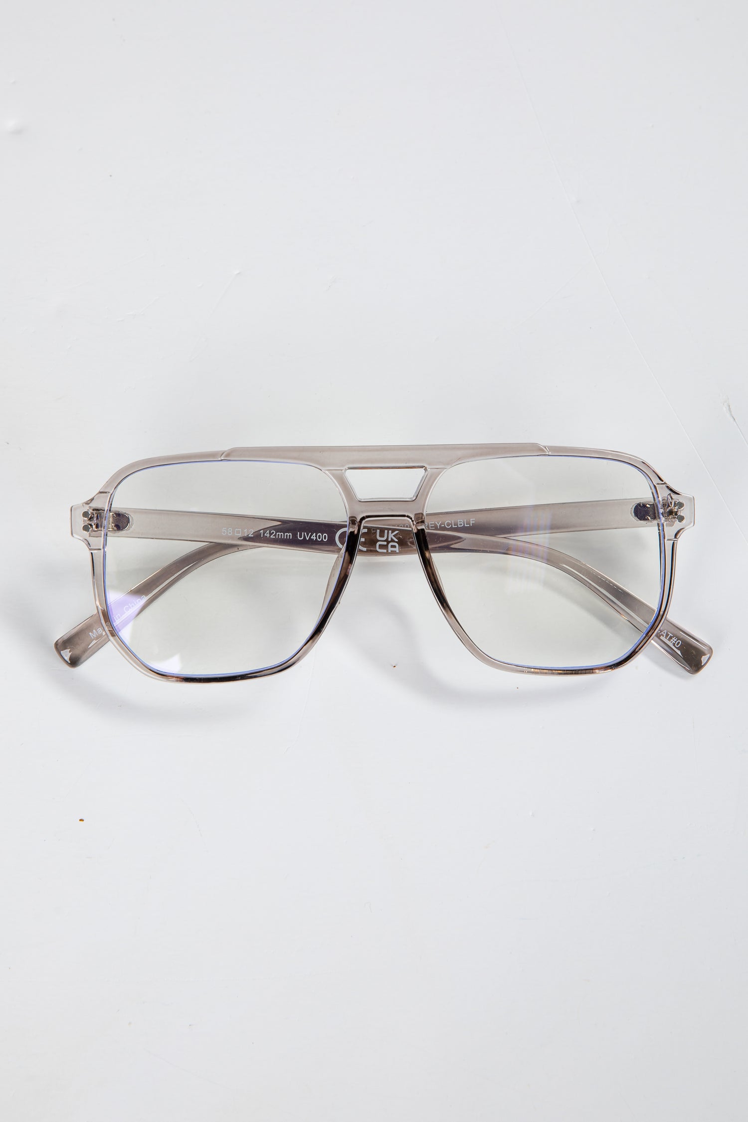 Gray aviator sunglasses on a white background