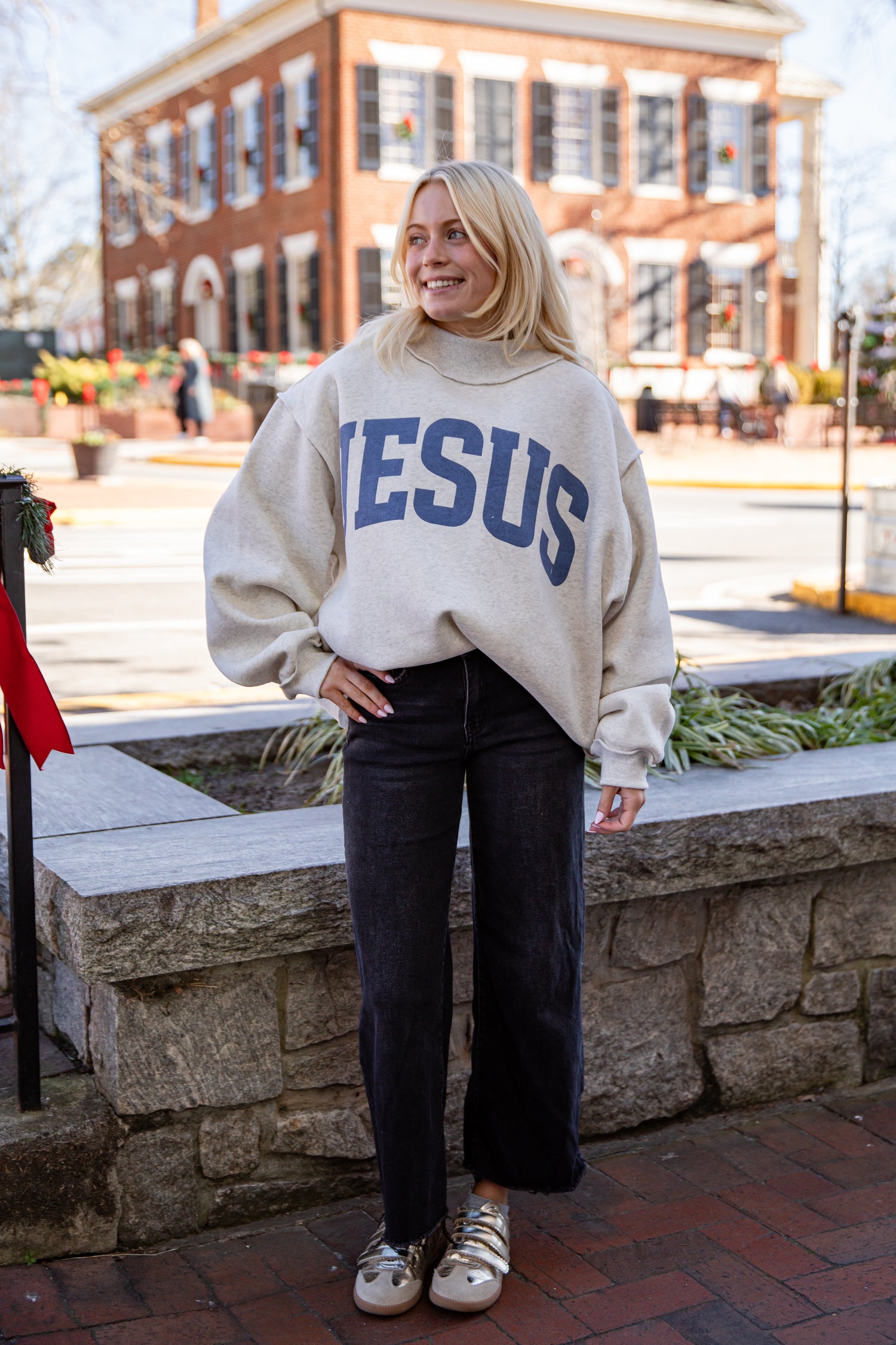 Person wearing a sweater with &