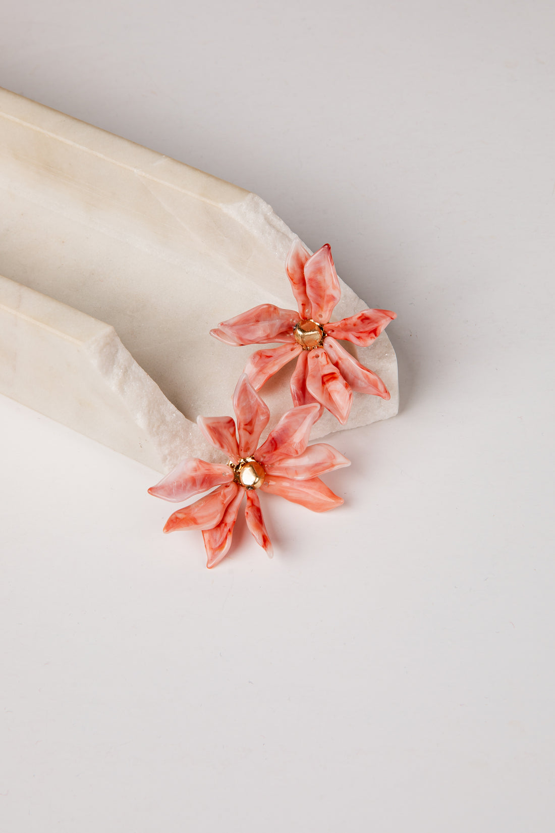 Floral earrings on a white background