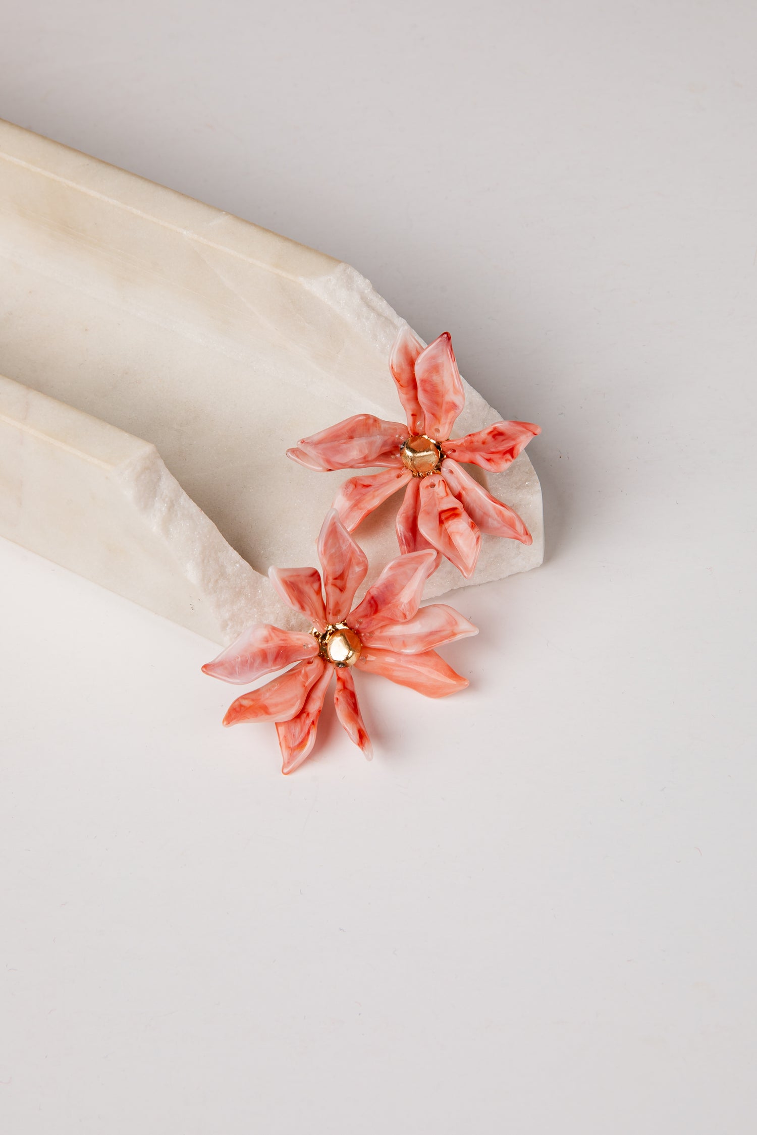 Floral earrings on a white background