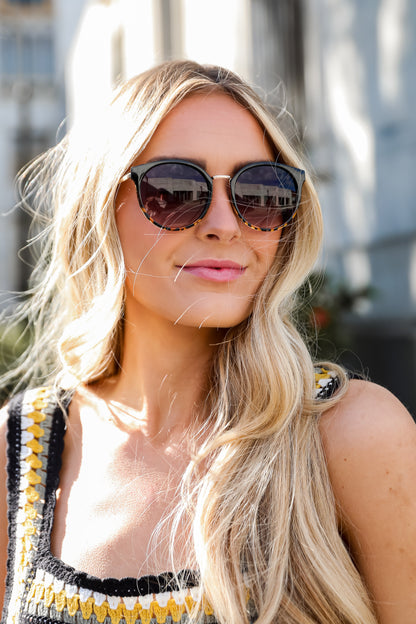 Woman wearing sunglasses with a blurred background