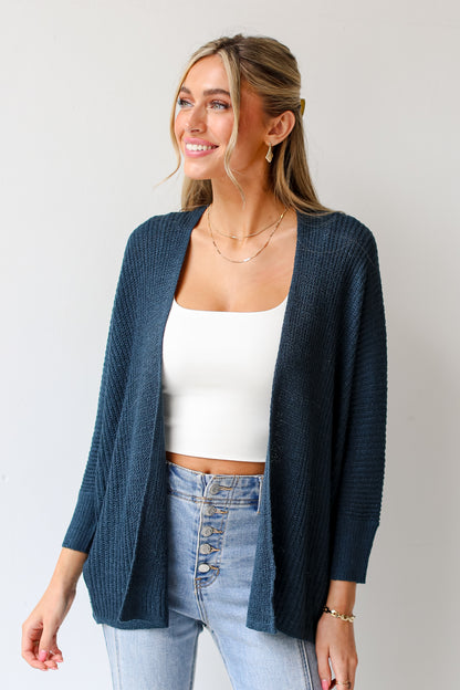 teal lightweight knit Cardigan on model with white tank