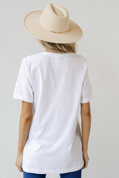 This comfy tee is designed with a soft and stretchy knit. It features a crew neckline, short sleeves, a relaxed fit, and the words "Bloom Where You&