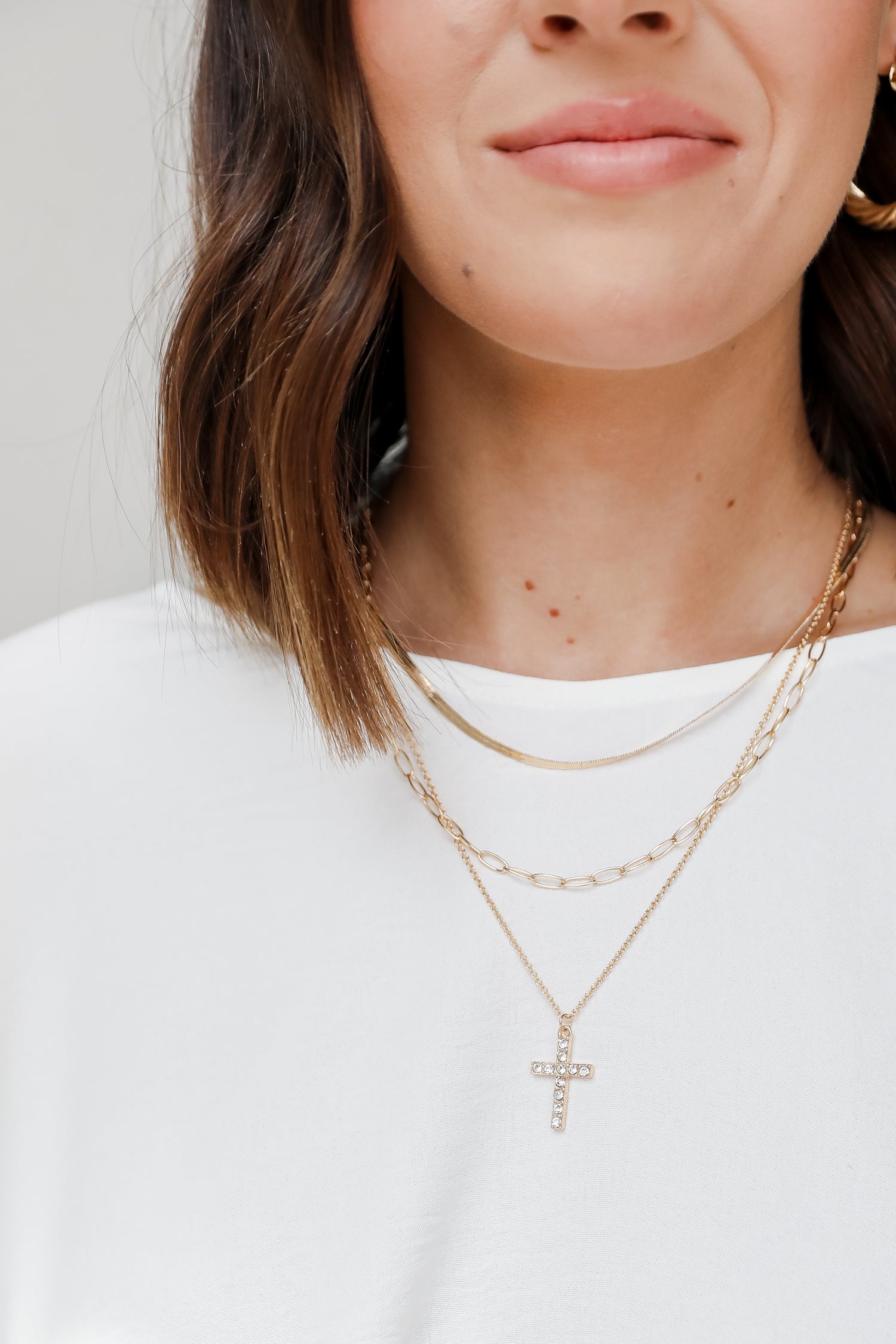 Gold Rhinestone Cross Layered Necklace on model