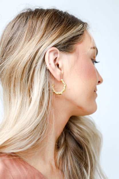 Gold Twisted Hoop Earrings on model