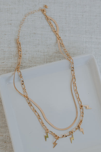 Gold Lightning Bolt Layered Necklace flat lay