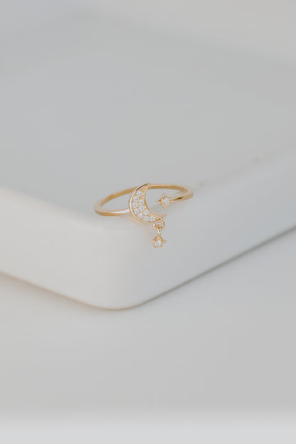 Gold Rhinestone Star + Moon Ring flat lay