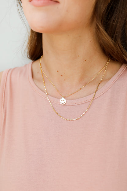Gold Smiley Face Layered Necklace on model
