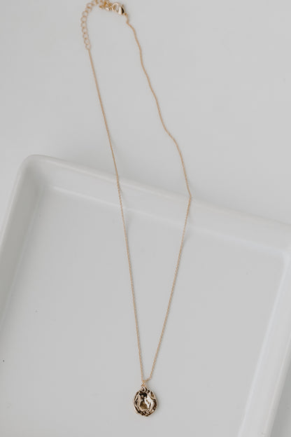 Gold Pendant Necklace flat lay